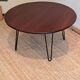 Round coffee table with mahogany wood top