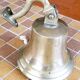 Polished brass bell with its stem