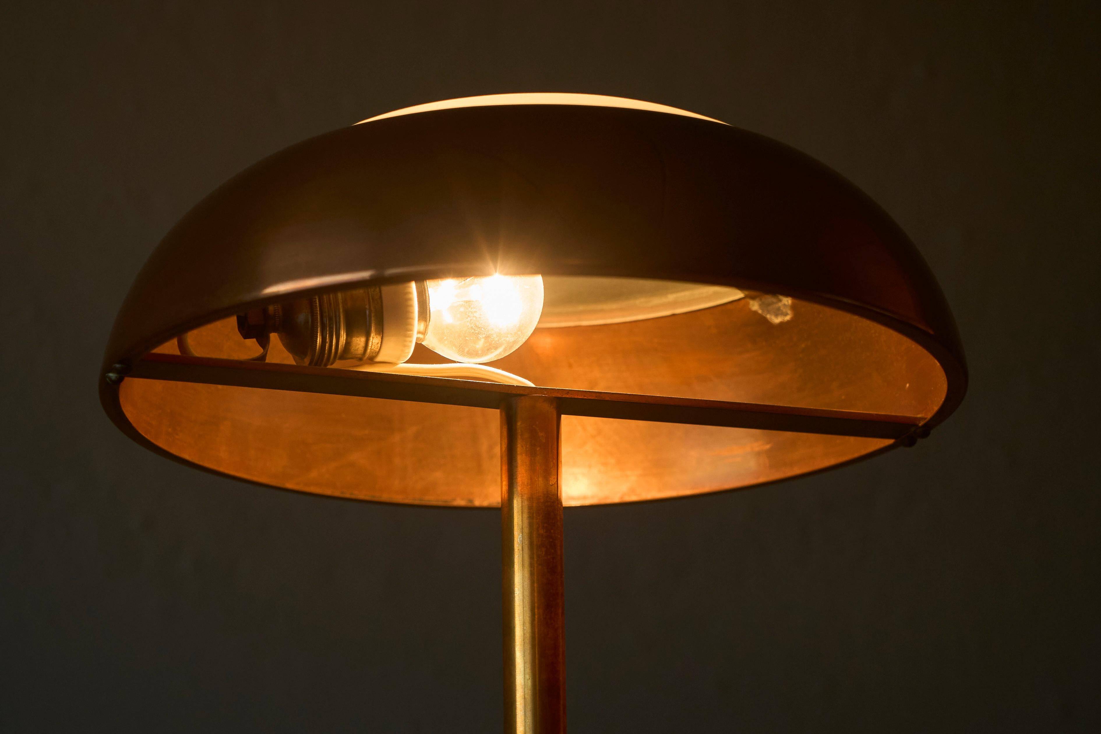 Art Deco table lamp in patinated copper, brass, and satin glass from the 1950s.