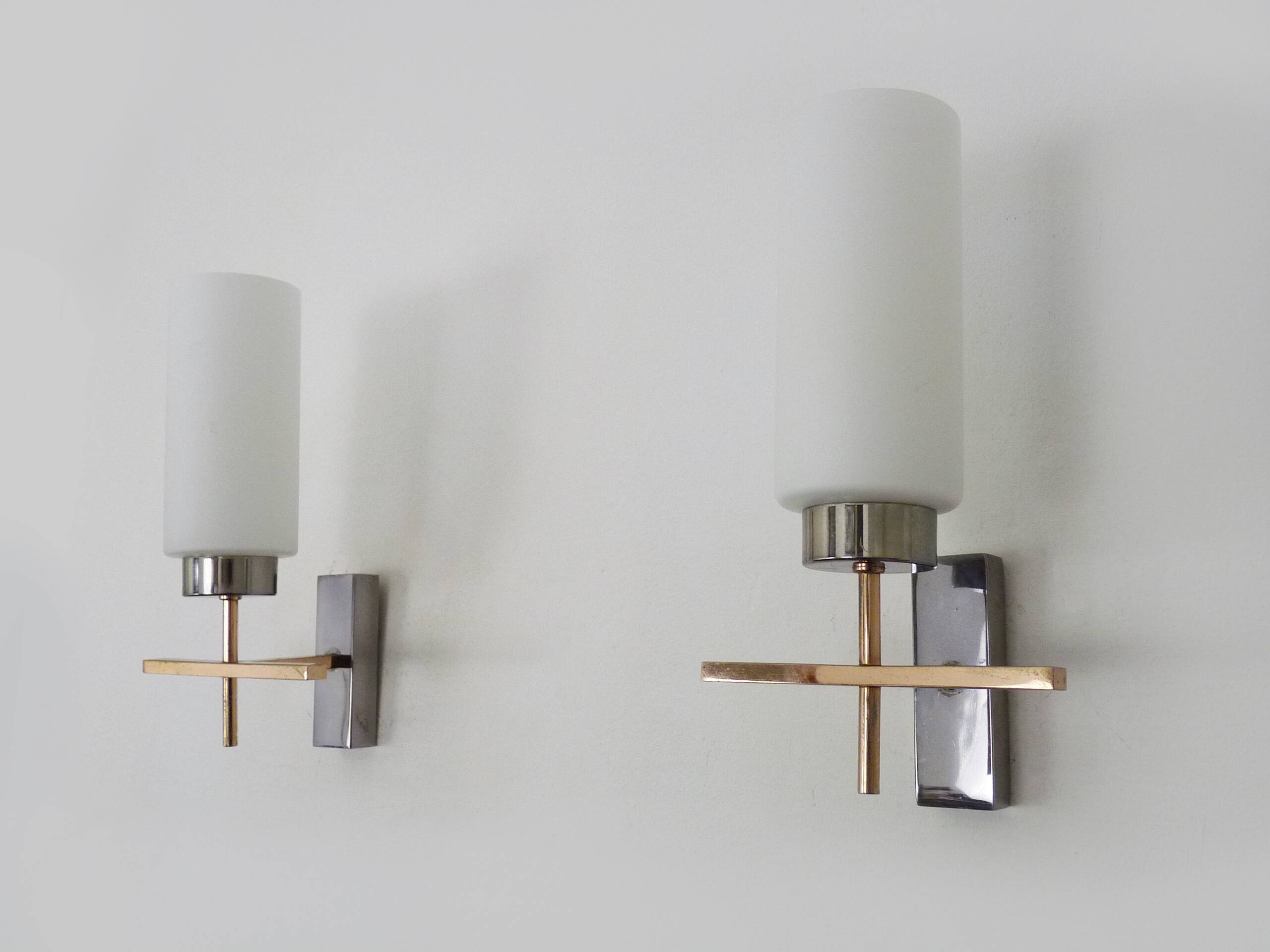 Pair of chrome-plated metal and opaline brass wall lights. 1960s