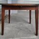 Antique round farmhouse table with drop-leaf doors in solid pegged wood