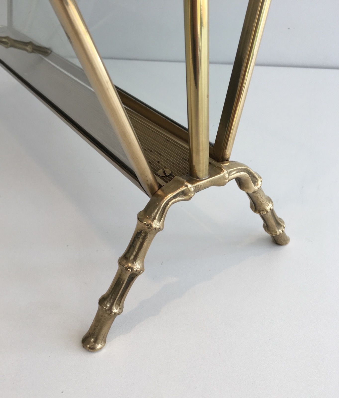 Bamboo-style brass magazine rack from the Baguès house.