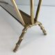 Bamboo-style brass magazine rack from the Baguès house.