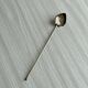 Vintage spoon in old metal, leaf pattern