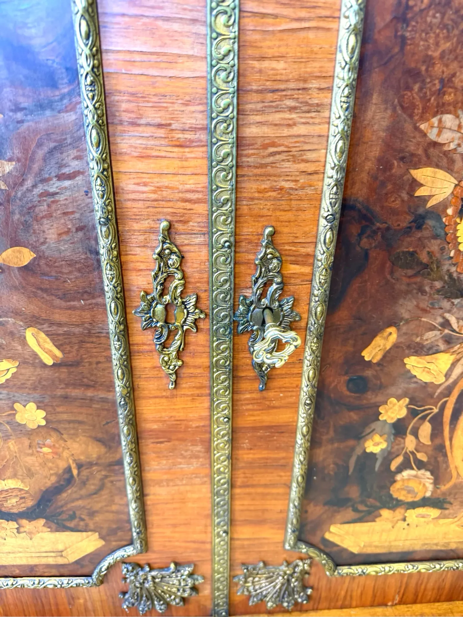 An antique French Louis XVI-style marble-top side cabinet