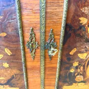 An antique French Louis XVI-style marble-top side cabinet