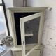 Corner display cabinet from the 1950s