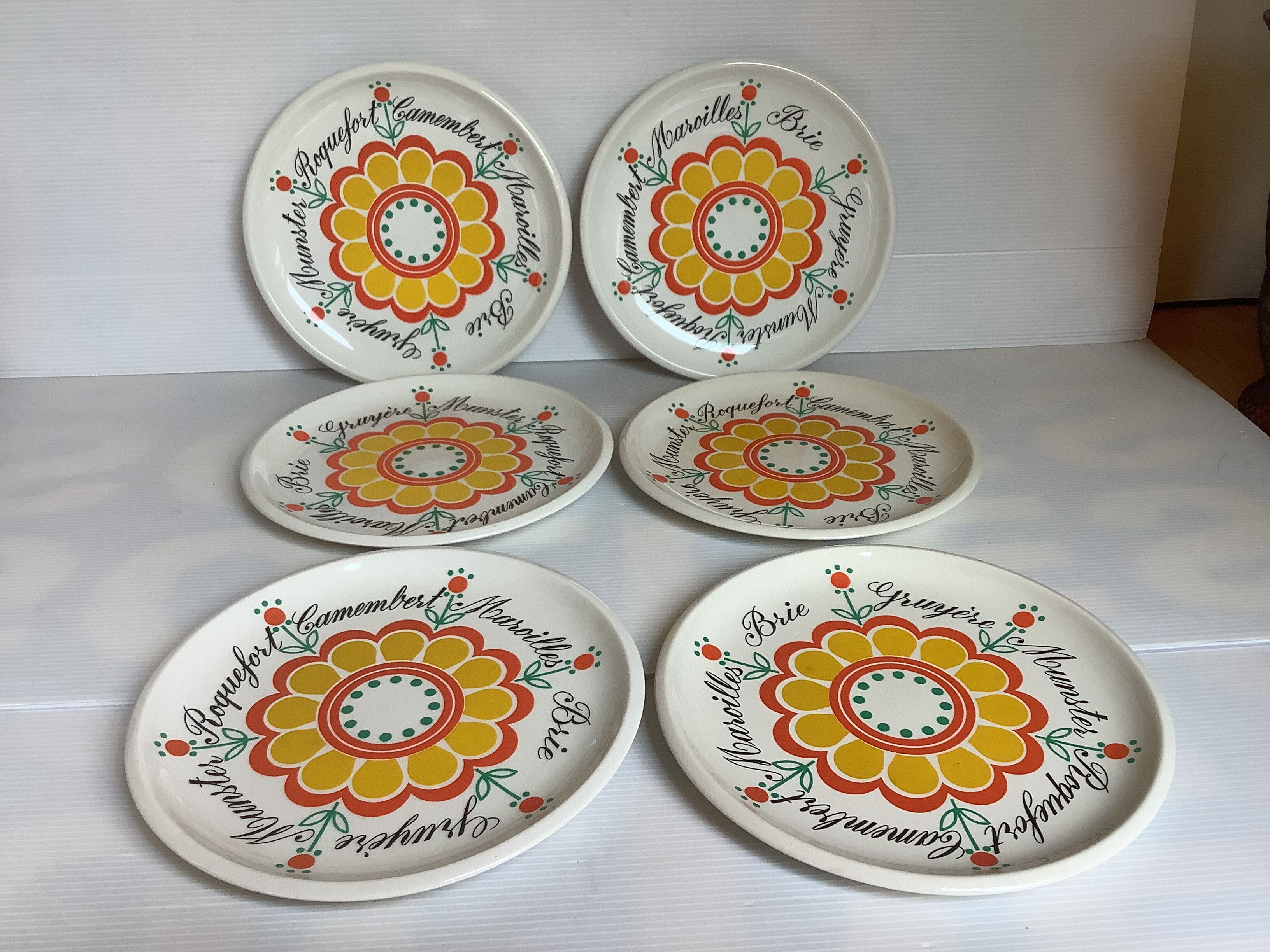 Six vintage floral cheese plates.