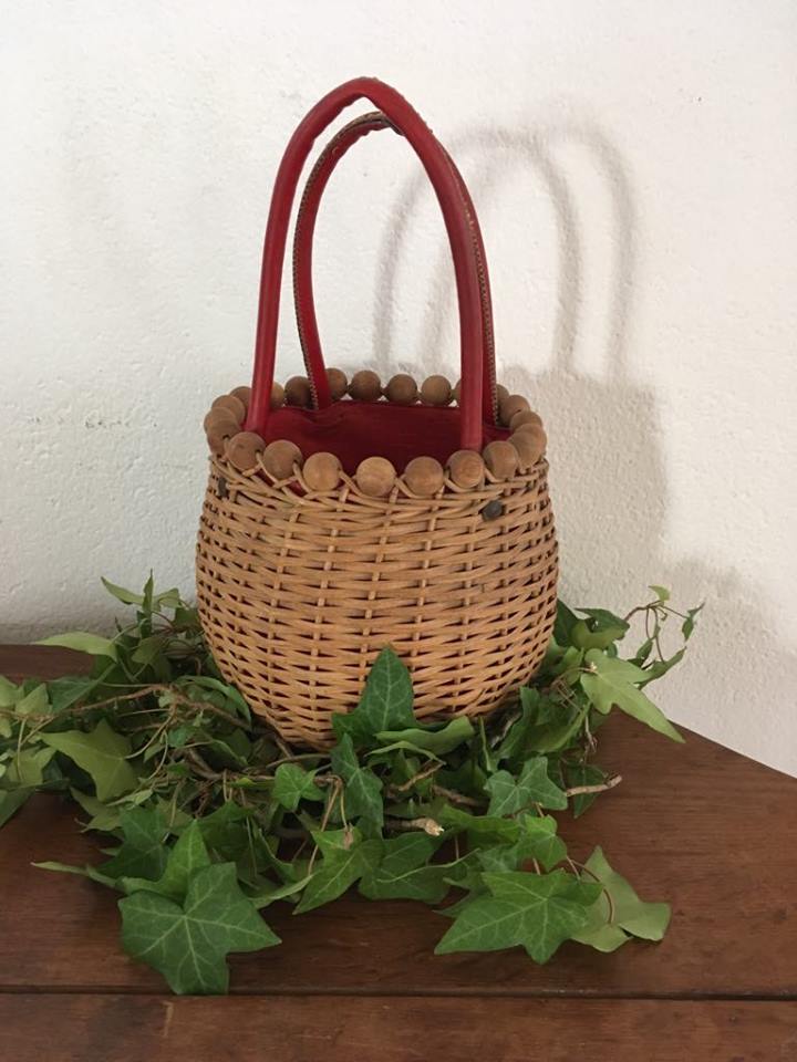 Wicker basket with a wooden bead border