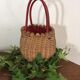 Wicker basket with a wooden bead border