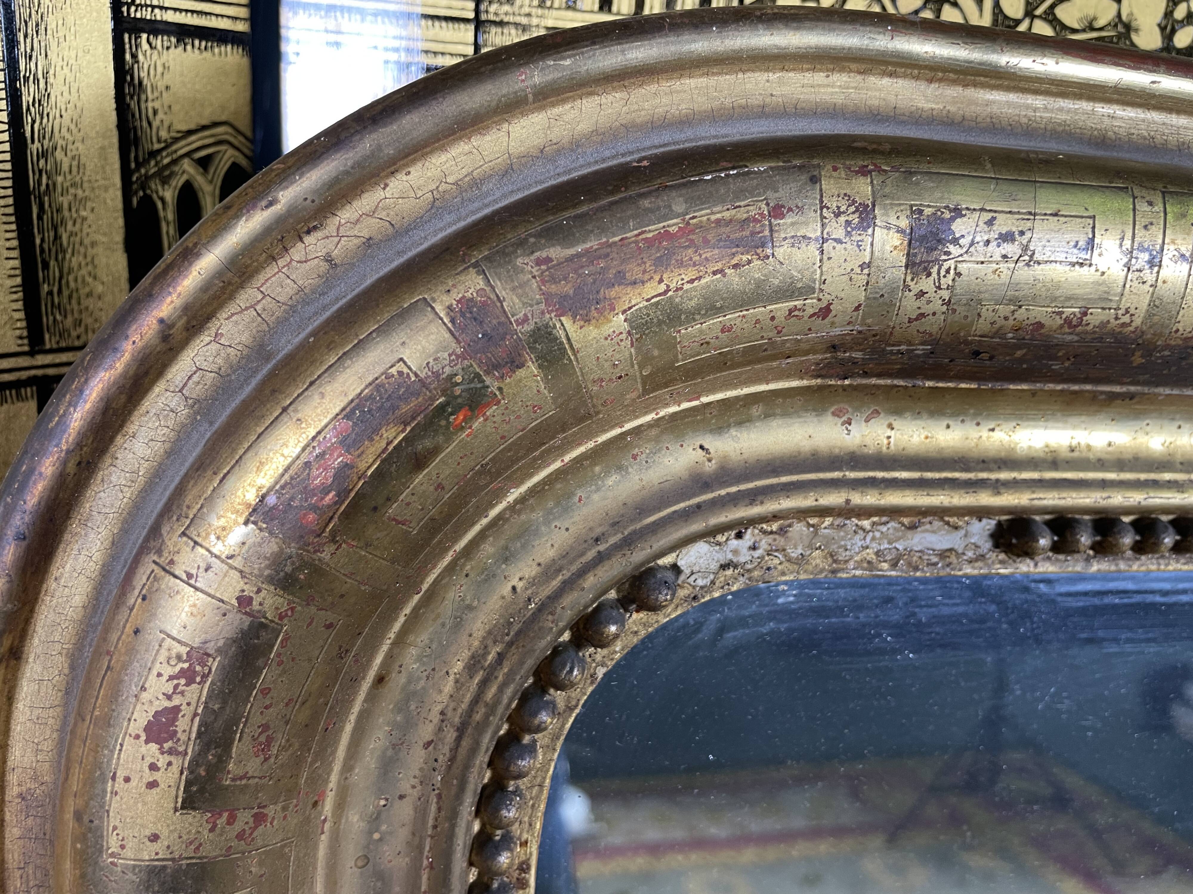 Louis Philippe period mirror with gold leaf