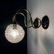 Pair of old swan neck wall lights in brass and transparent glass globe