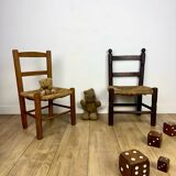 Pair of old wooden and straw children's chairs.
