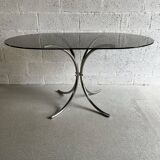 Oval table in smoked glass and chrome steel