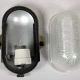 Glass and Bakelite wall light from the 1950s.