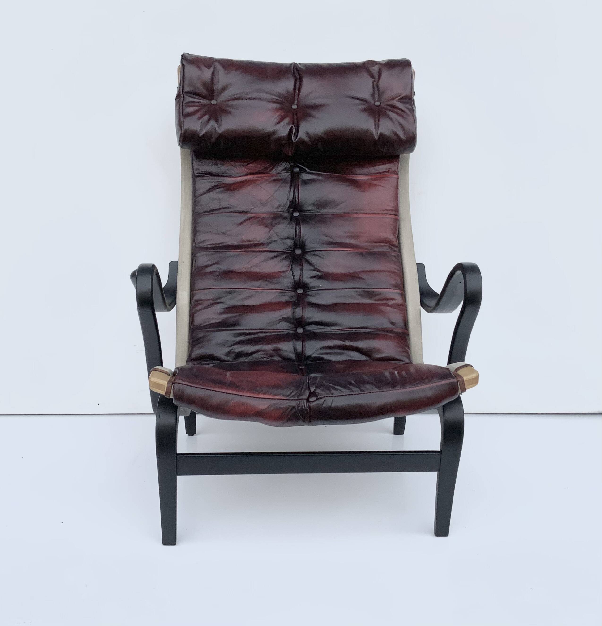 Vintage Pernilla 69 Armchair by Bruno Mathsson for Dux In Oxblood Leather
