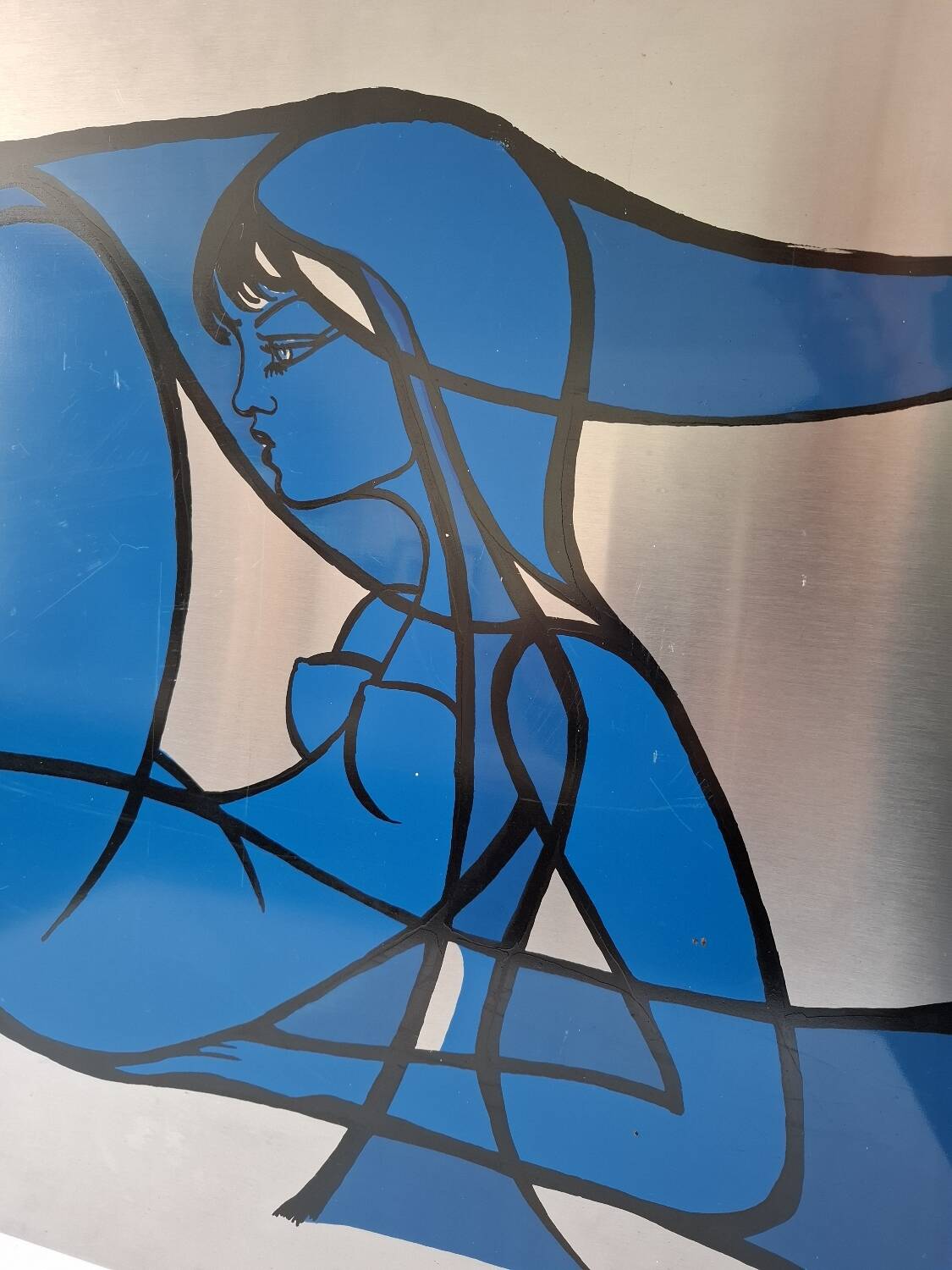 Silkscreen on brushed aluminium from the 1970s.