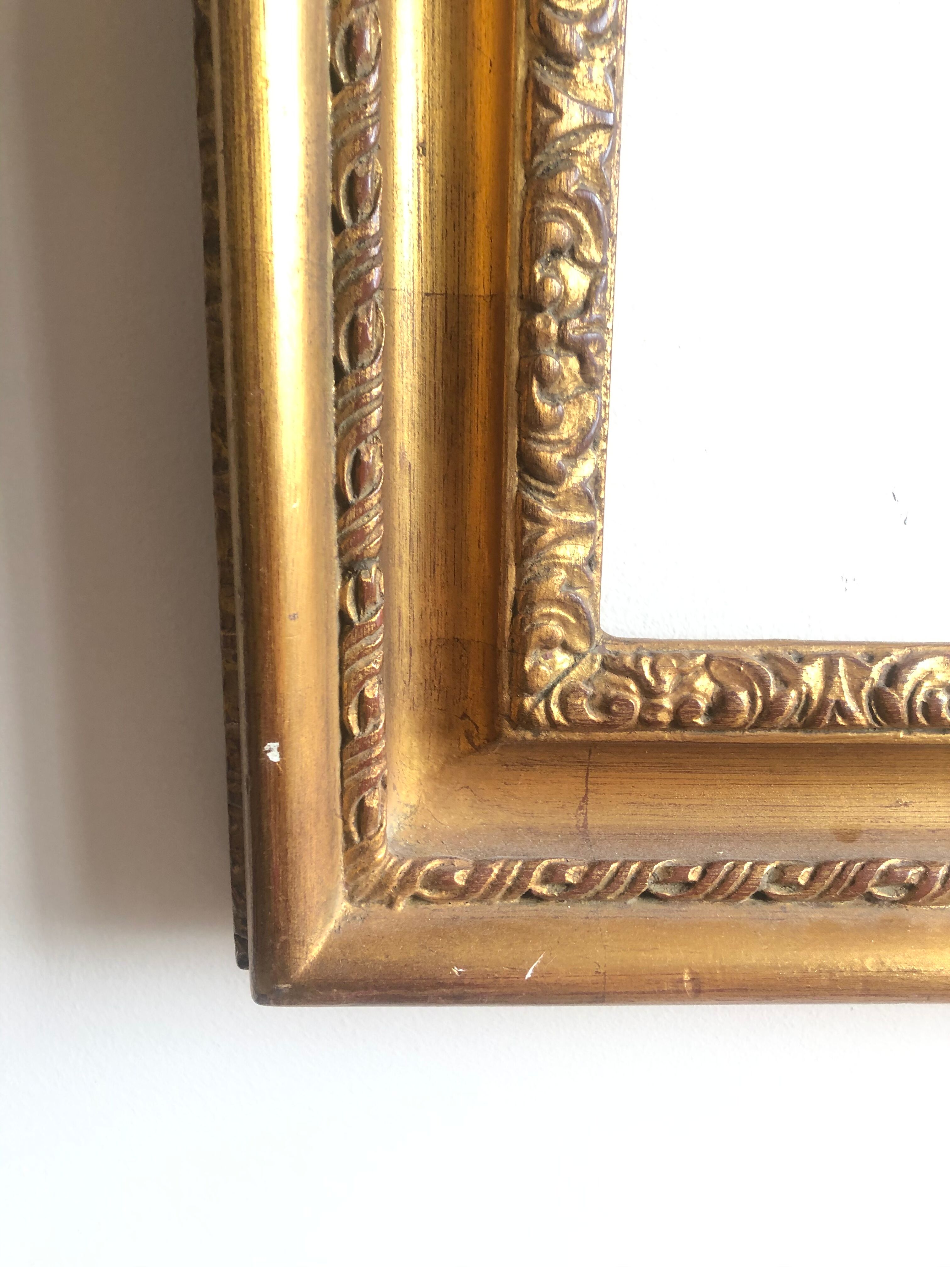 Wooden frame and gilded stucco