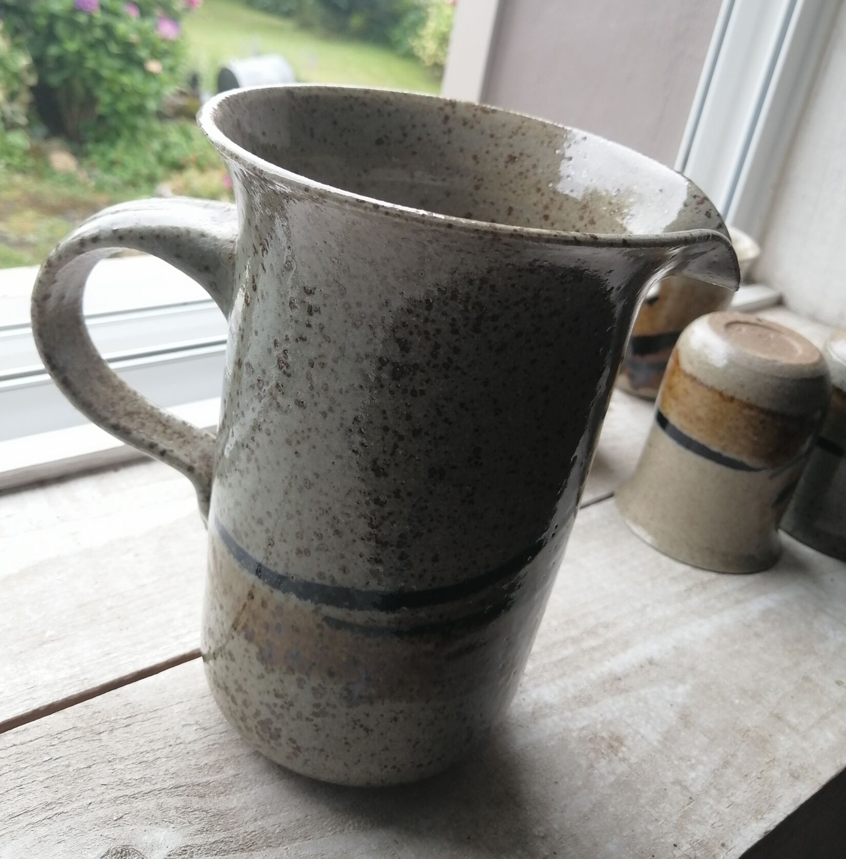 Enamelled sandstone pitcher and glasses
