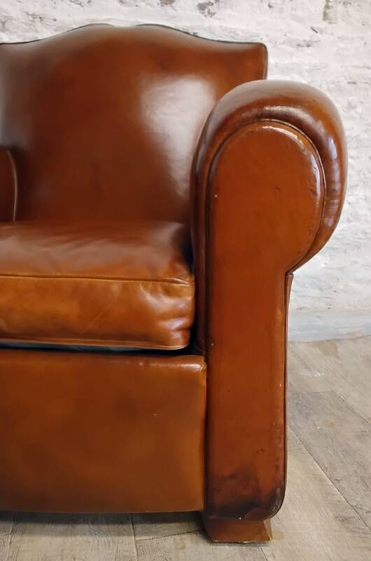 Club chair with a moustache backrest