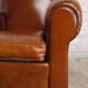 Club chair with a moustache backrest