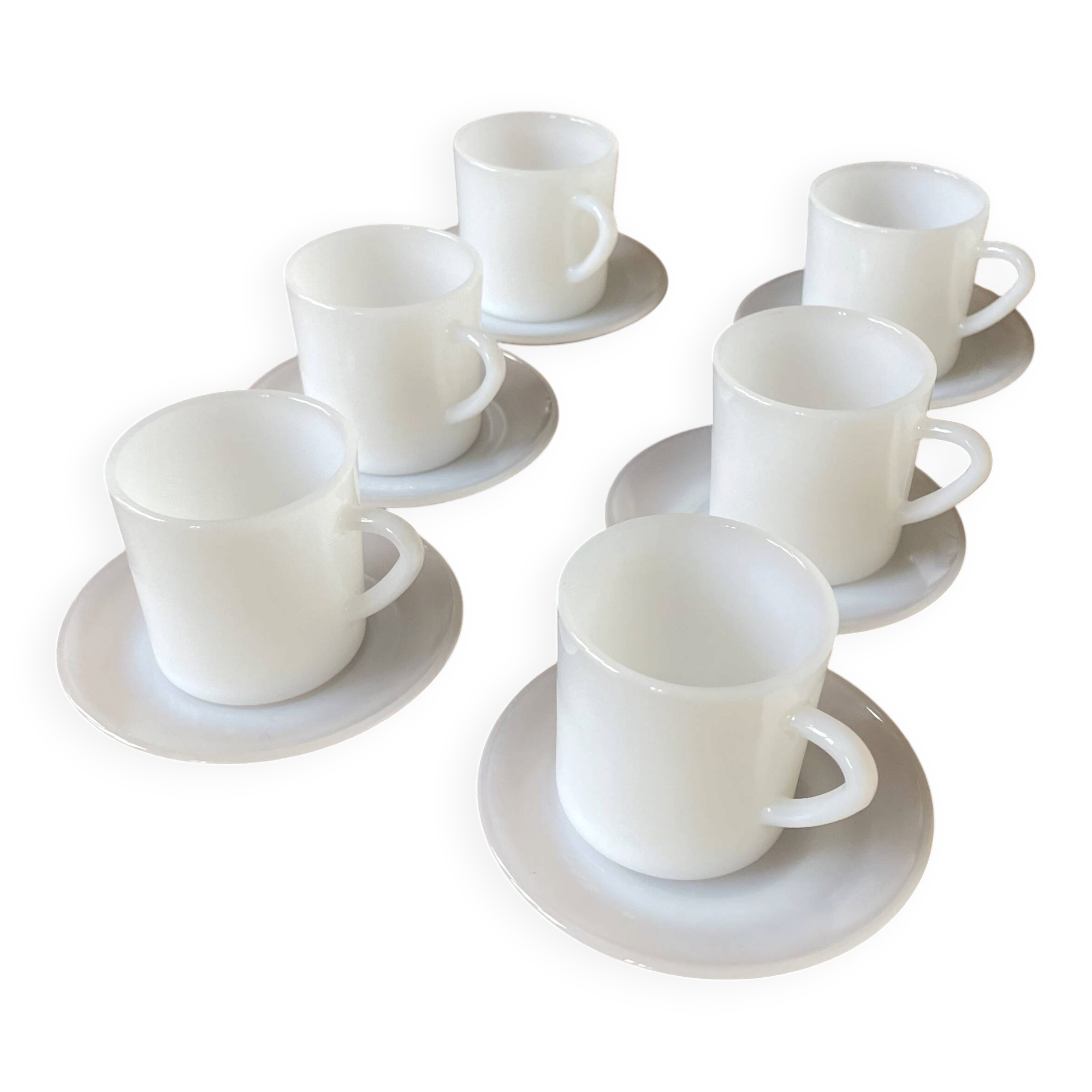 Espresso coffee cup service, Nestlé promotional items, in white glass.