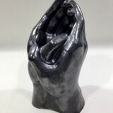 Vase with intertwined hands