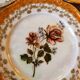 6 mismatched dessert plates decorated with roses