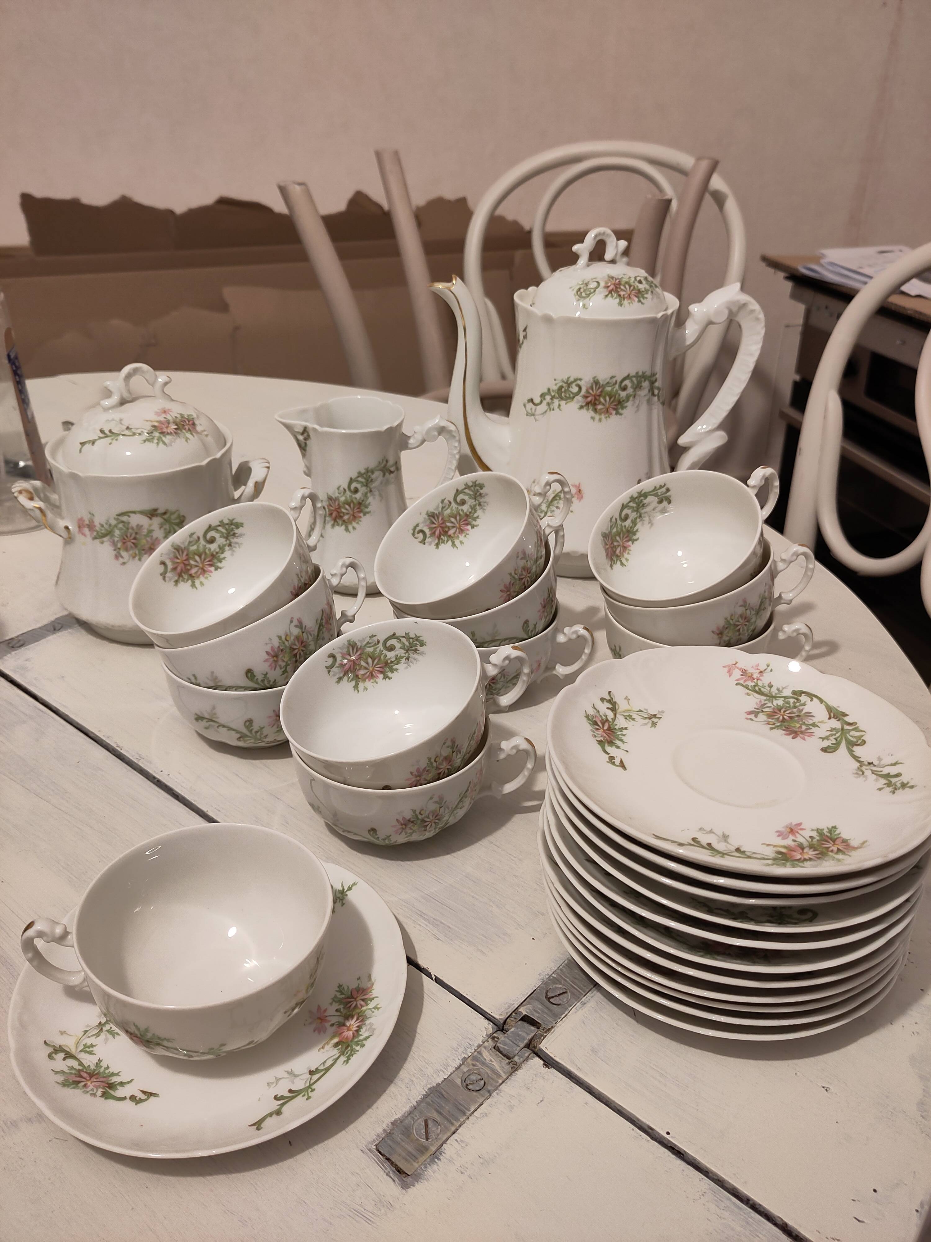 Coffee and tea cup service with plates and saucers.