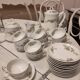 Coffee and tea cup service with plates and saucers.