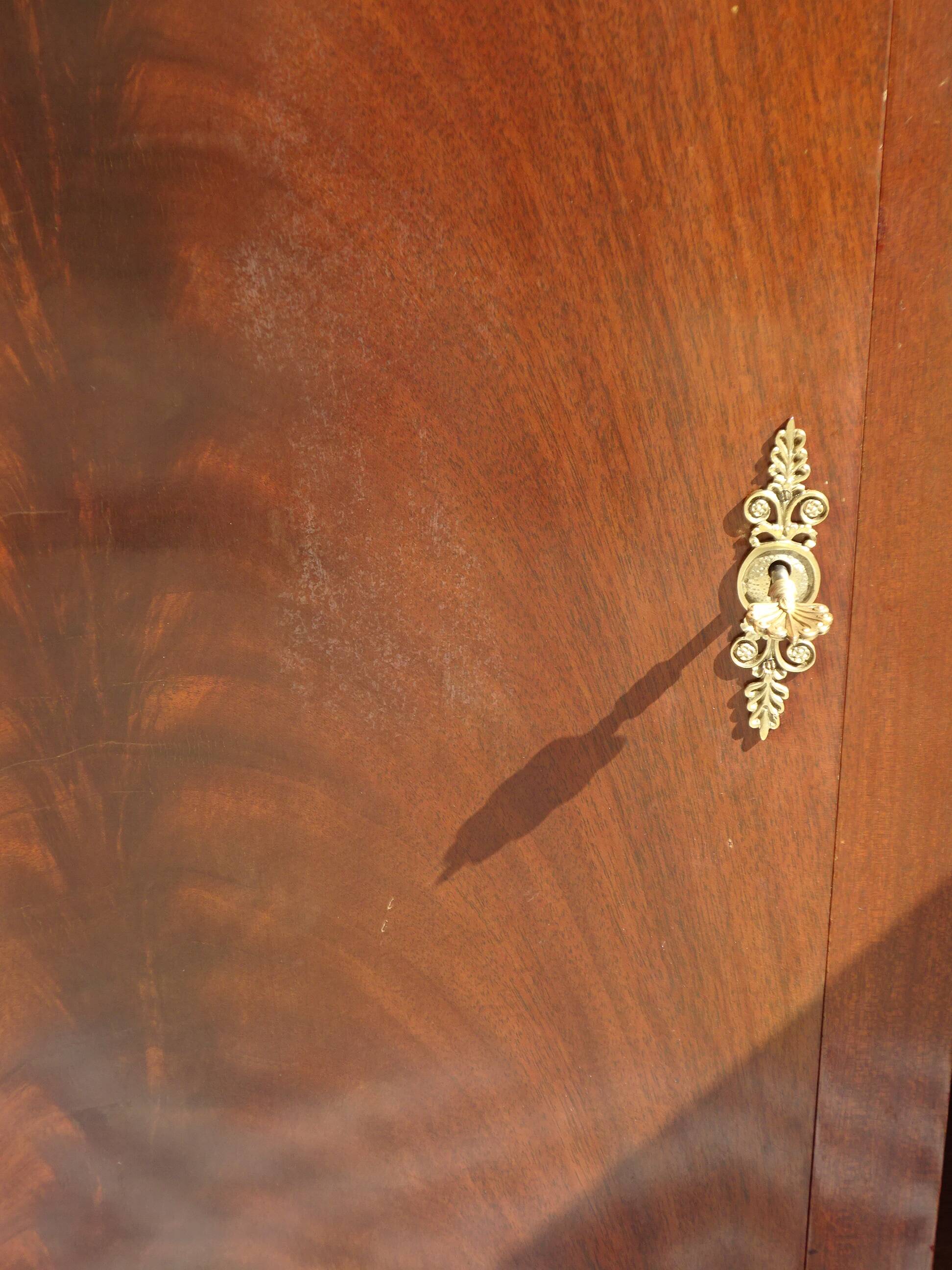 Flamed mahogany enfilade with sea green marble in Empire style.