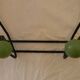 Small wrought iron coat rack with wooden balls.