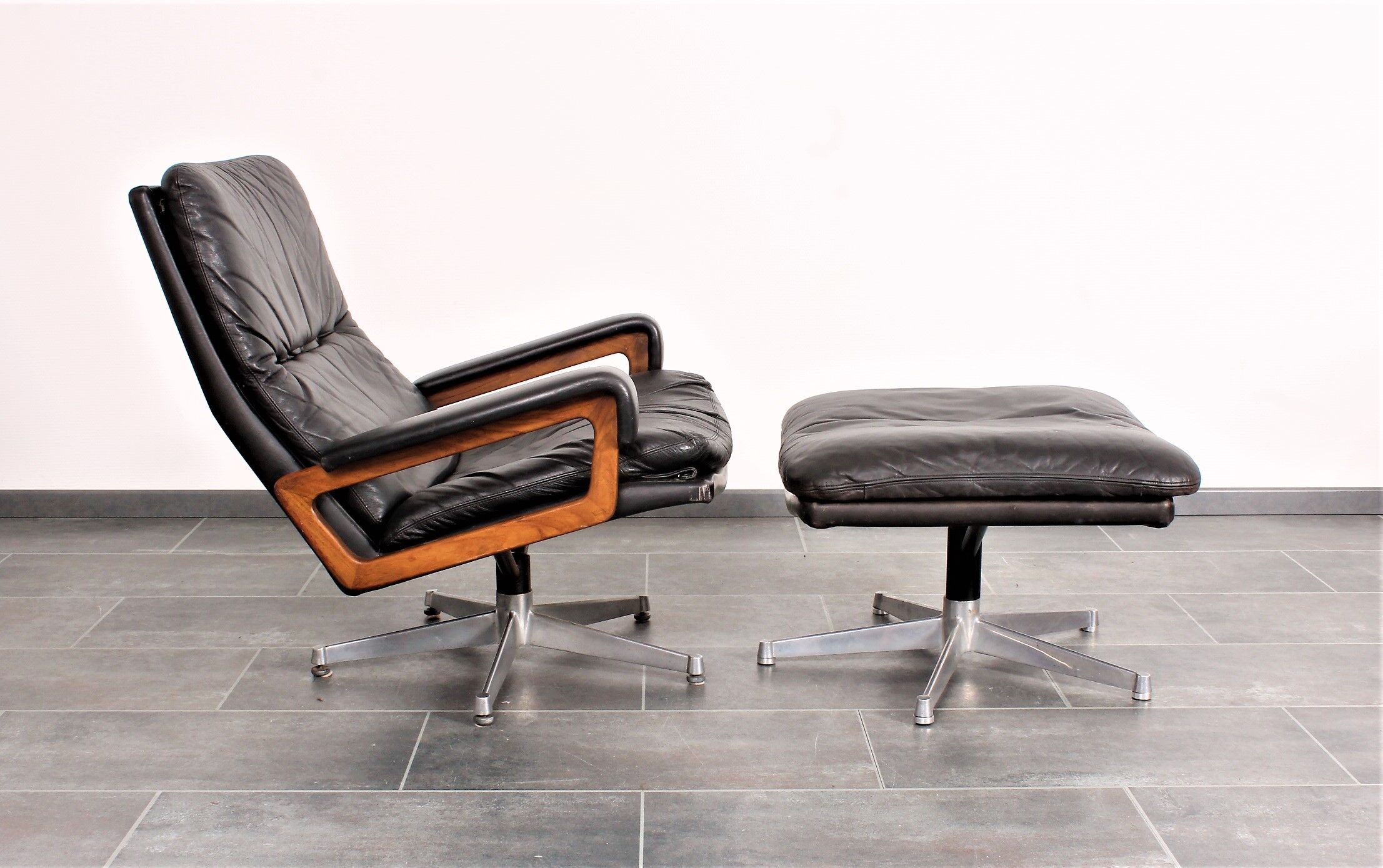 Armchair and footstool by André Vandenbeuck for Strässle in black leather