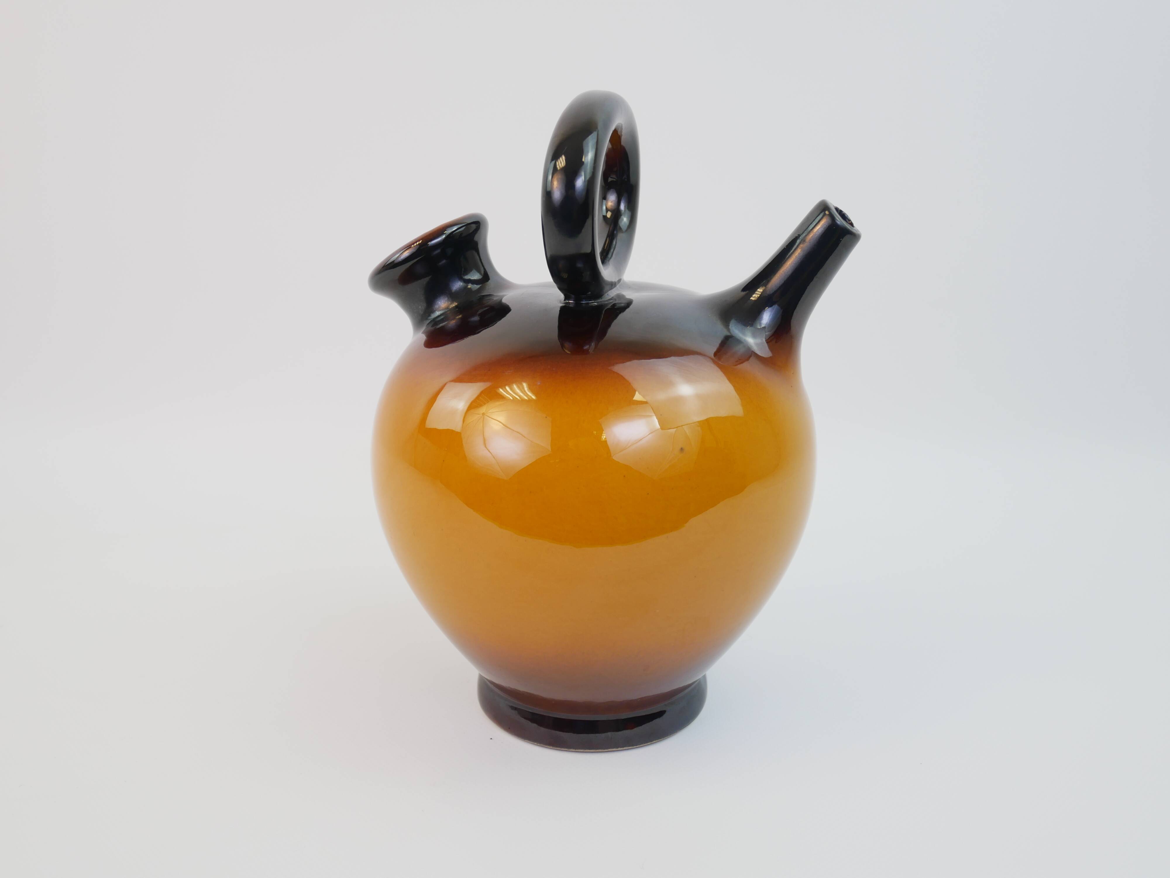 Ochre-orange ceramic jug signed under the base CP Claude Paci