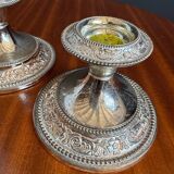 Silver-plated metal candlesticks from the 1980s.