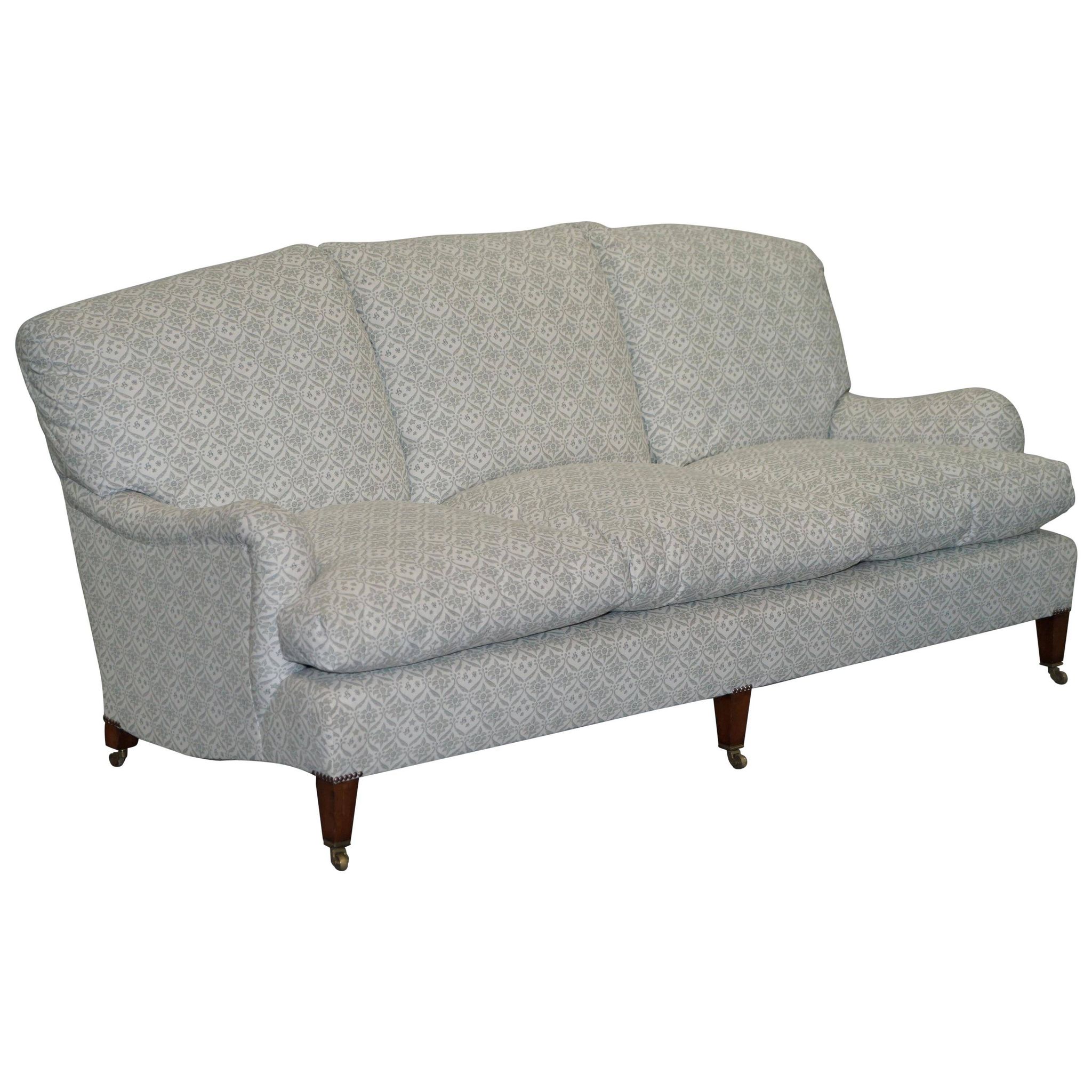 Howard & Sons canapé with feather cushions and ticking fabric, Victorian style.