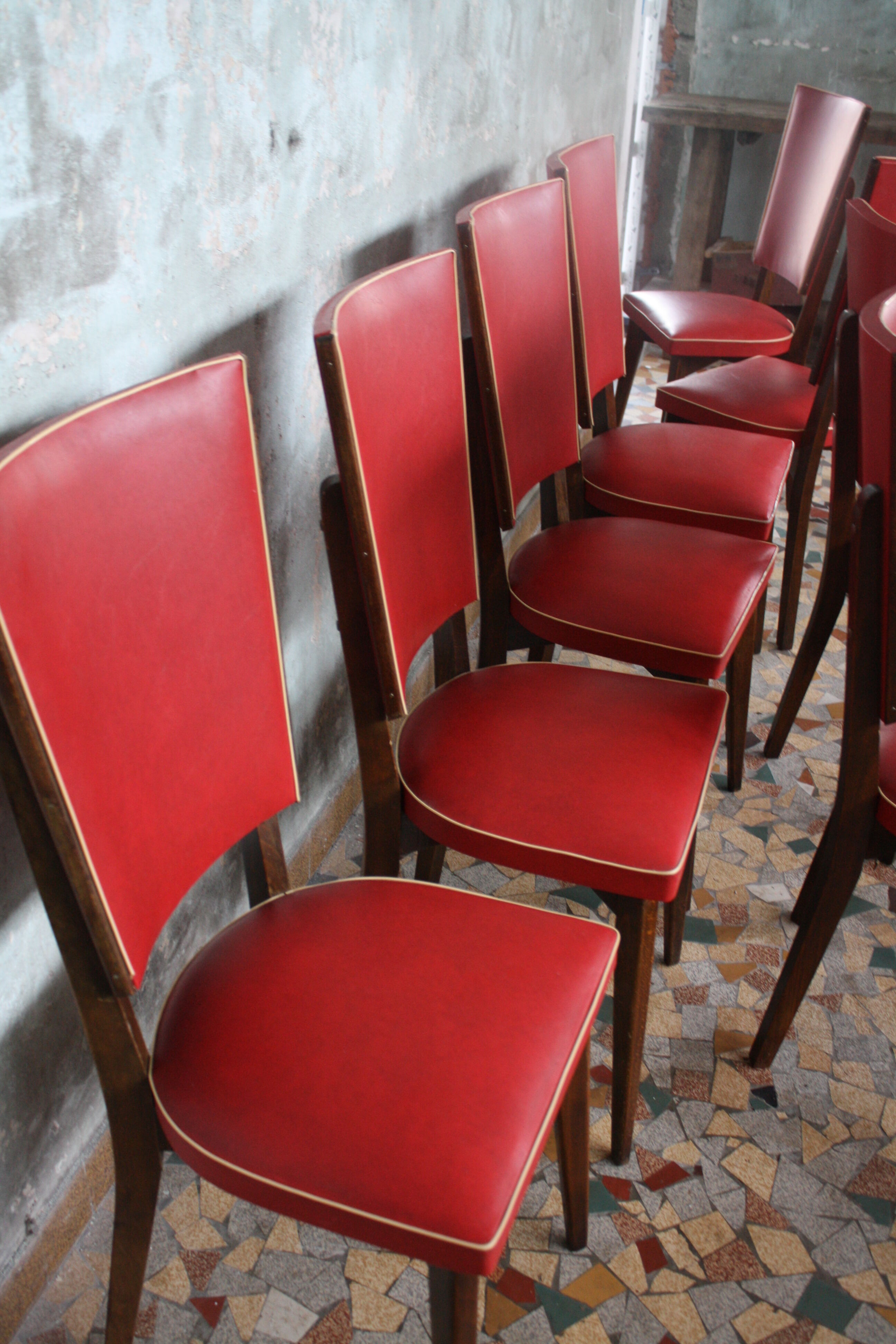 Lot of 8 vintage wooden chairs and red skai