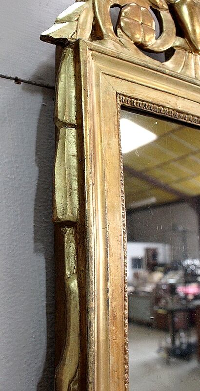 Miroir en bois doré, style Louis XVl, début XXe