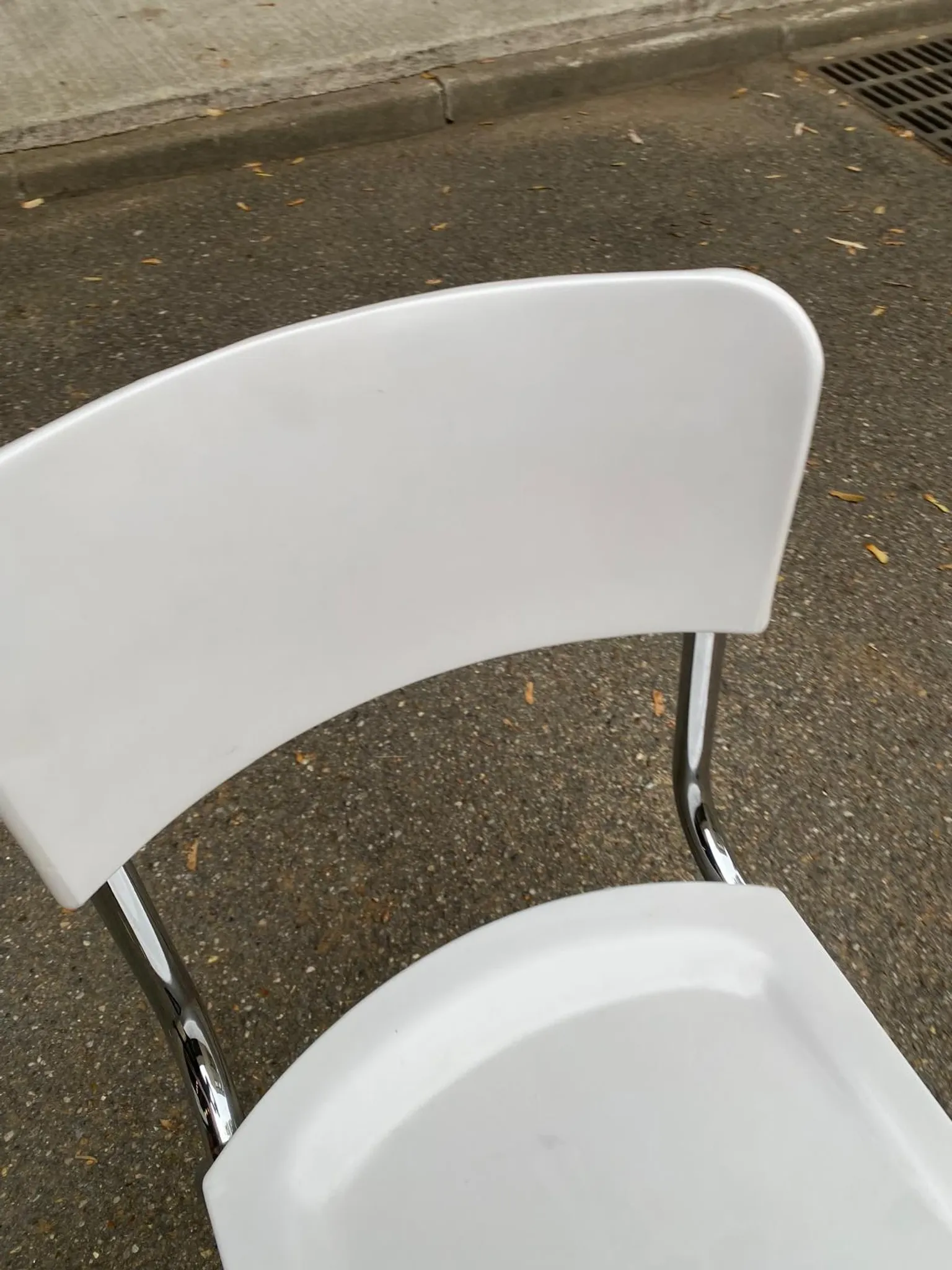 Space age chair with chrome metal and white schoolboy shell, desk 1970.