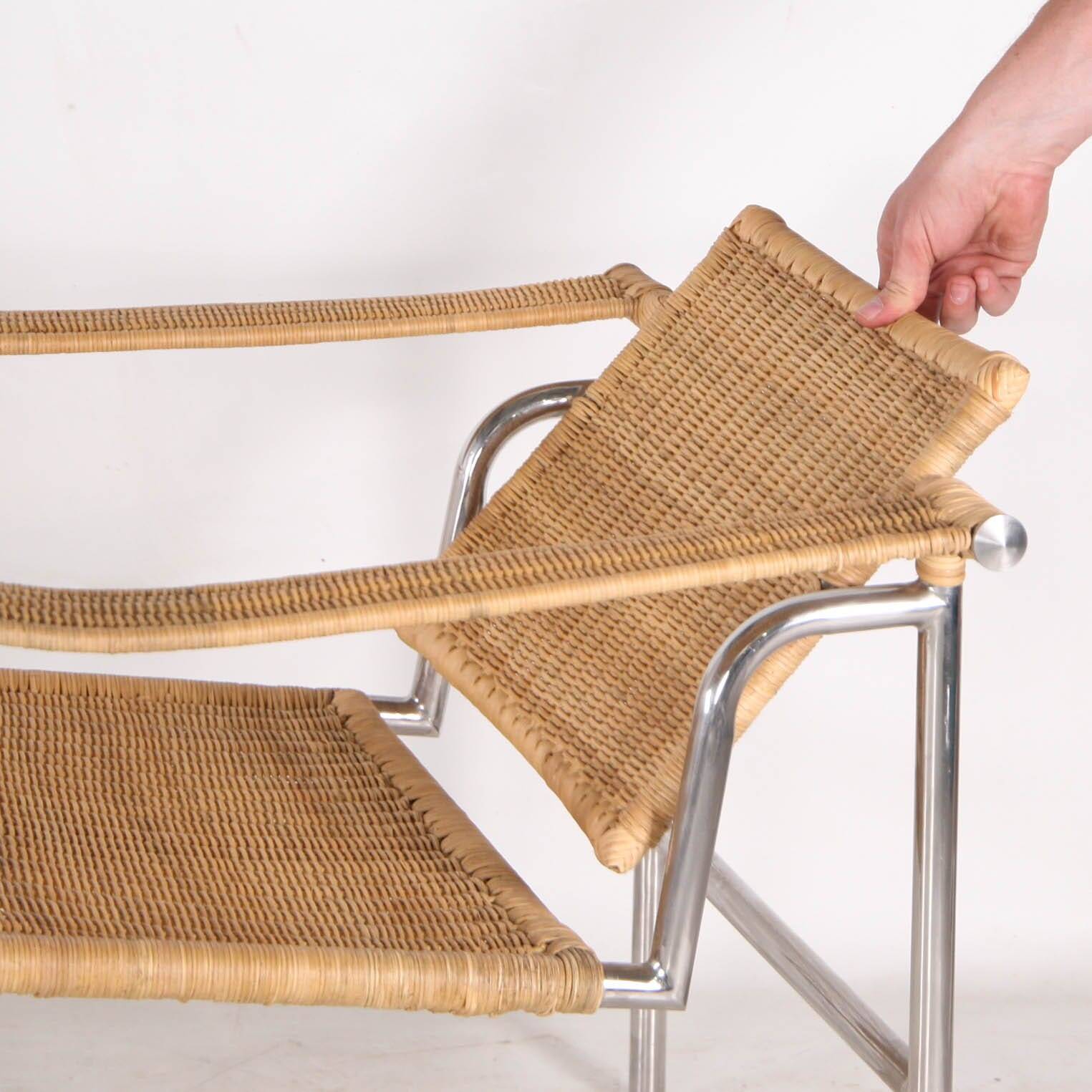 Pair of wicker and chrome armchairs