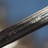 Old box of 12 small white metal spoons