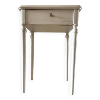 Old patinated beige bedside table