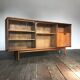 Row / teak, part glass, Mid century Scandinavian buffet