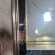 Vintage display coffee table in gilded brass and glass with a lock.