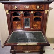 Rare Empire period mahogany secretary with four columns topped with bronze capitals.