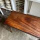 Folding table, dark wood console.