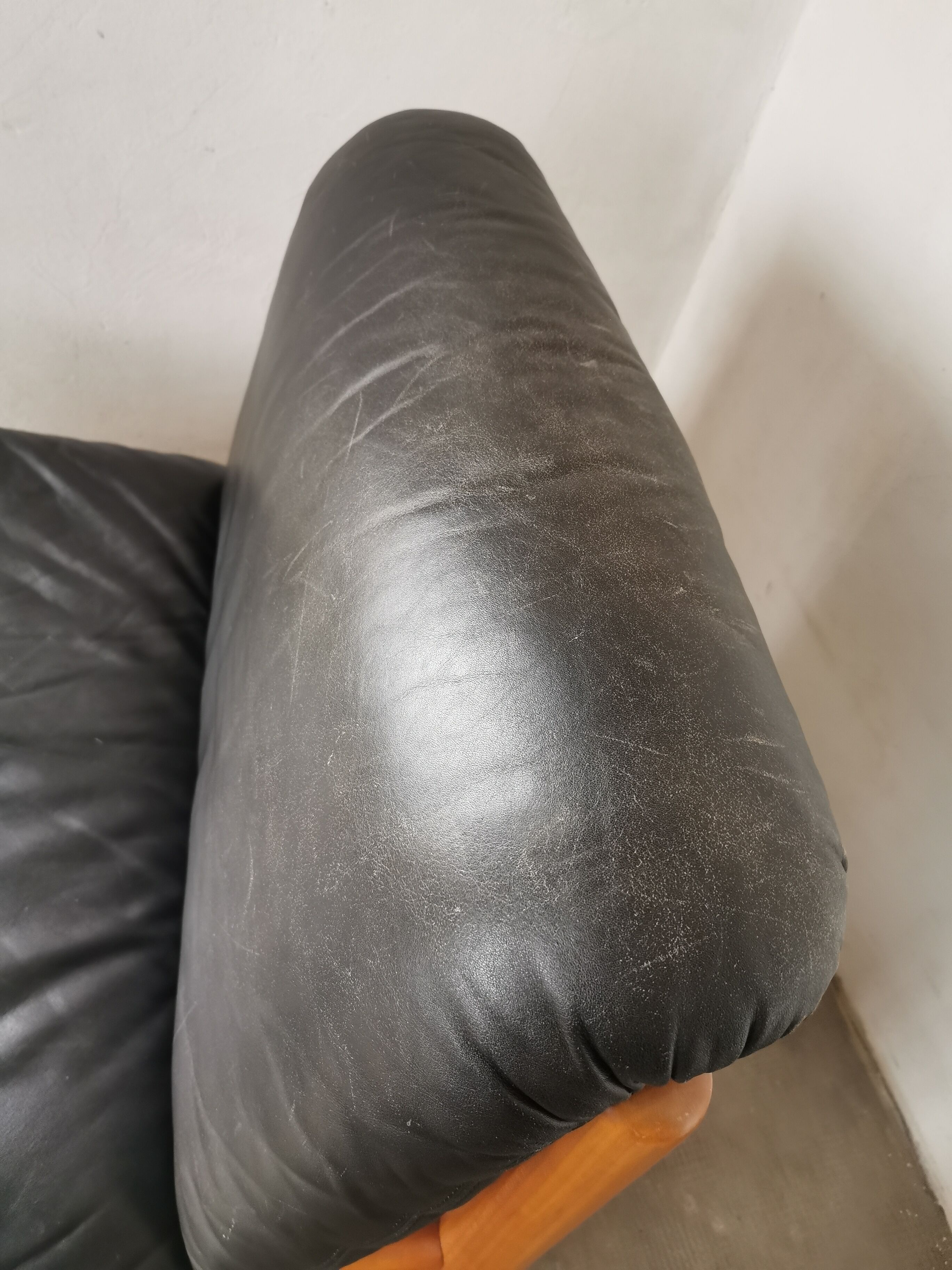 Pair of designer leather armchairs 80s