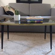 Vintage coffee table with tapered legs.