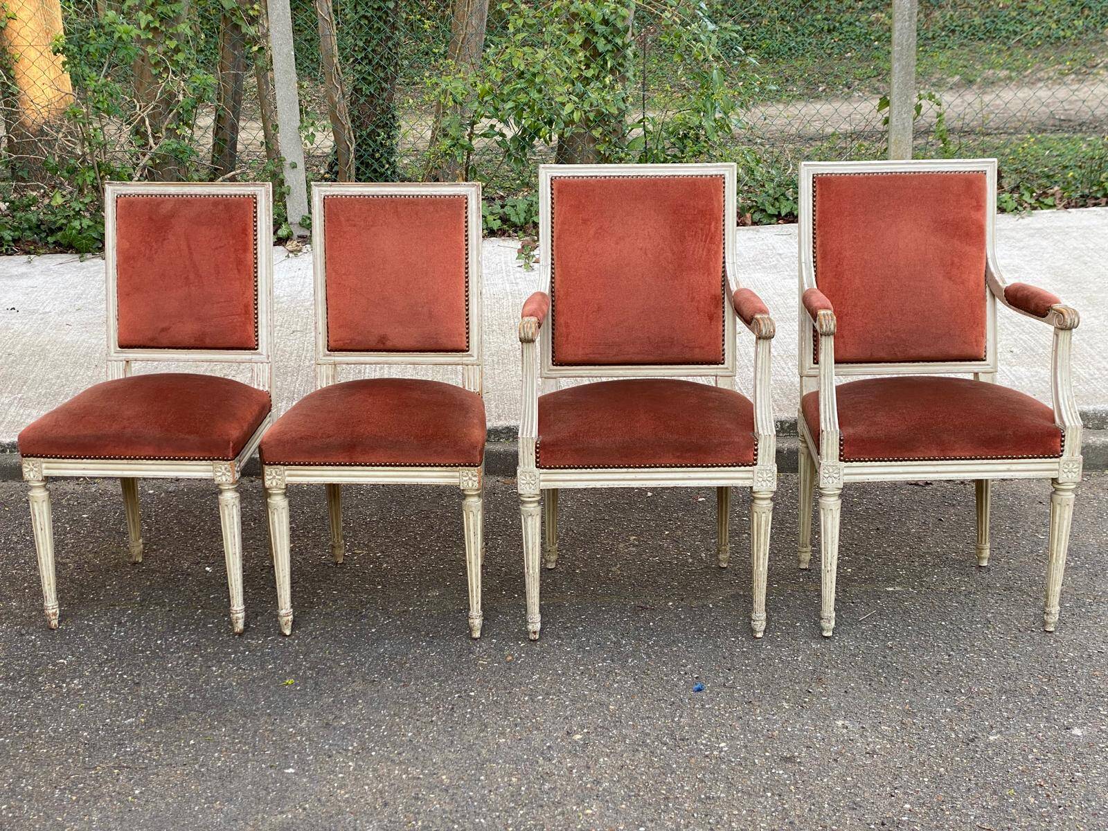 2 Louis XVI armchairs in solid wood and orange velvet.