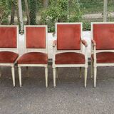 2 Louis XVI armchairs in solid wood and orange velvet.